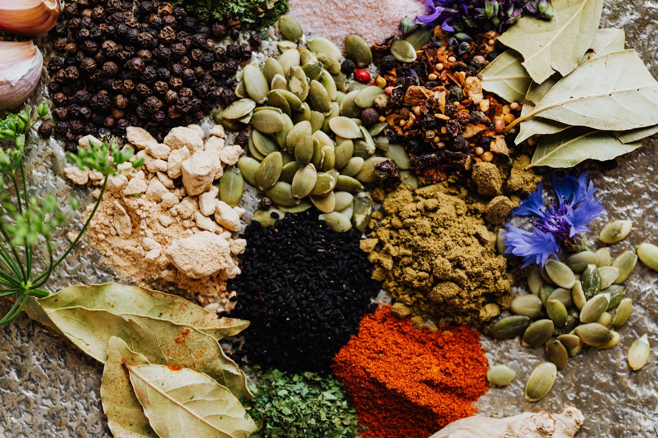 High-quality flat lay of various spices and herbs, perfect for culinary arts or food blogging.